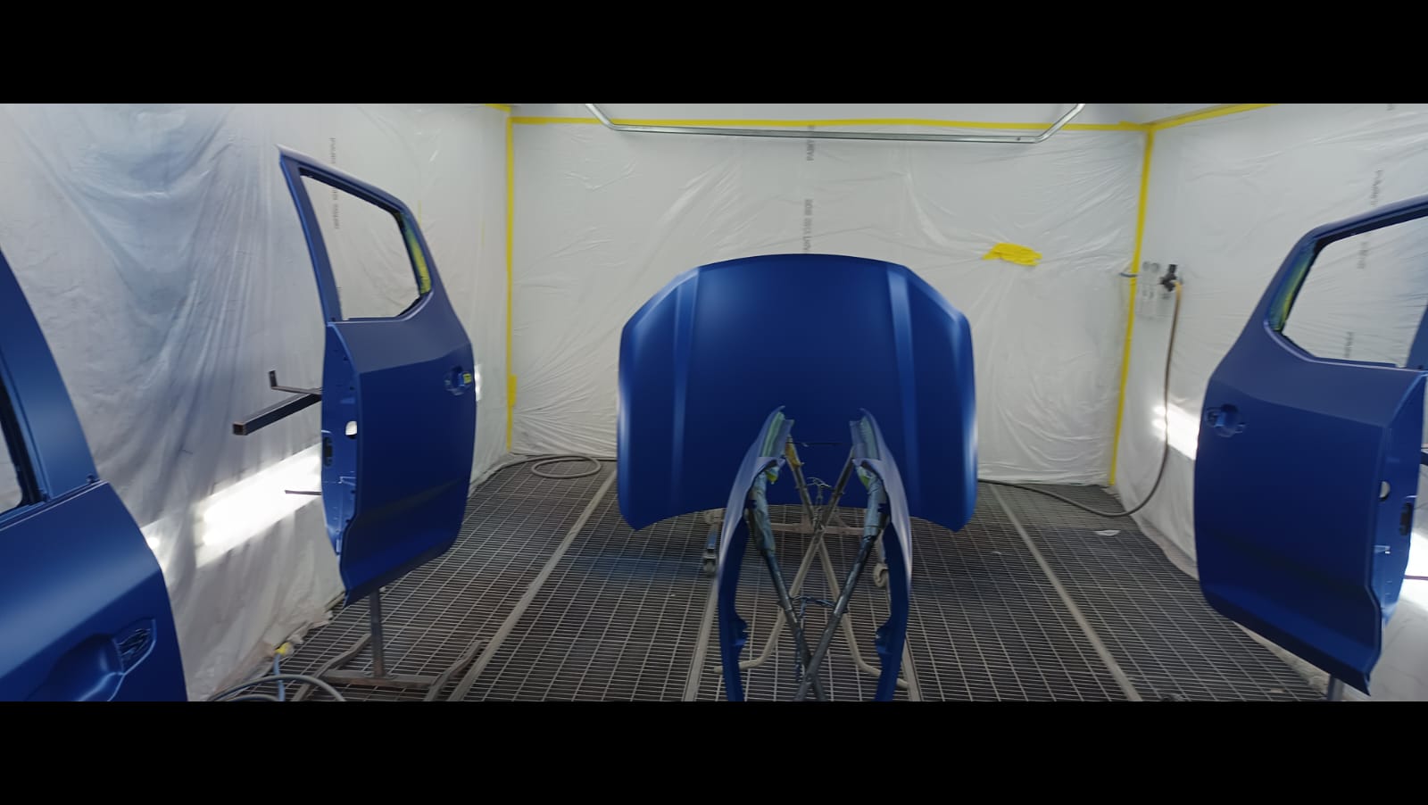 Vehicle panels in the Alfa Body Works spray booth