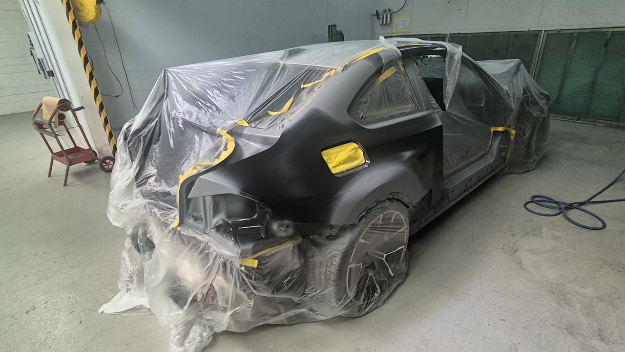 A vehicle masked for preparation in the Alfa Body Works workshop